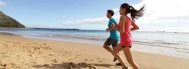 girls running on a beach