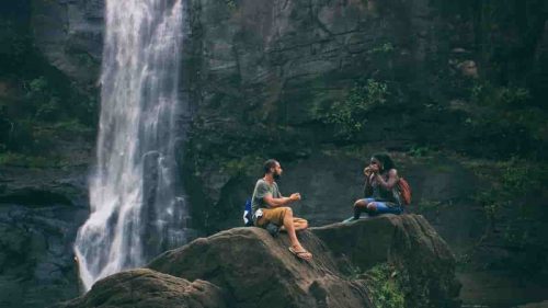 couple enjoying near waterfall