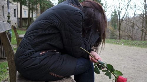 sad woman with rose