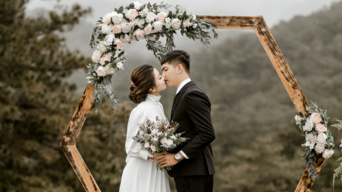 a couple kissing at their wedding