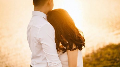 happy couple near a lake