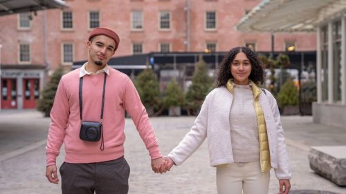 a guy and girl holding hands