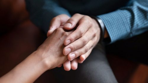 man holding a women's hand