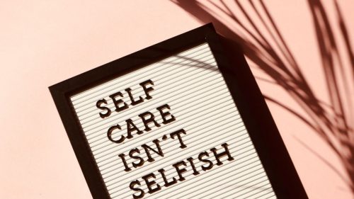 self care isnt selfish text on white background