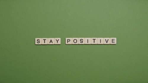 stay positive text on green background
