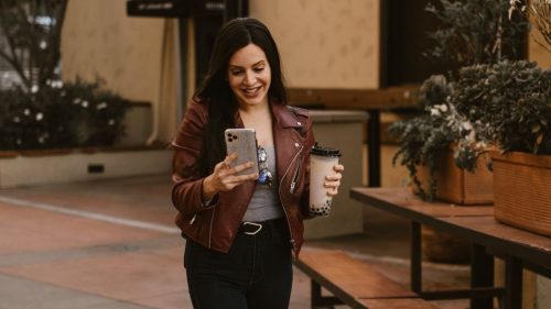 a woman on a mobile video call and walking