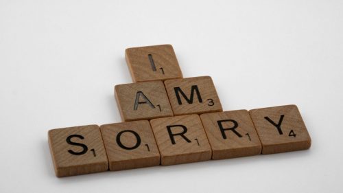 i am sorry scrabble tiles on white background