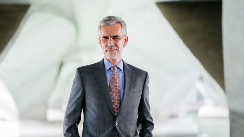 man with grey hair wearing suit